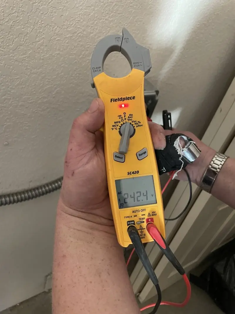 Voltage testing with clamp meter during Aluminum Wiring Replacement in Elon